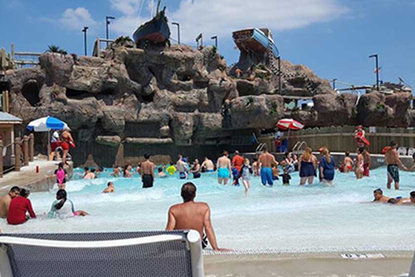 Guests in The Harbor wave pool at Breakwater Beach