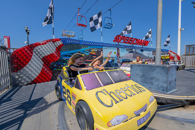 Child driving a car on the Speedway kiddie ride