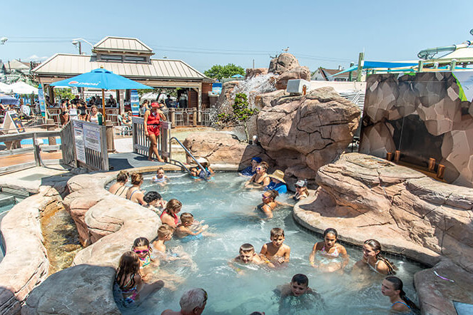 Guests relaxing in Plymouth Rock Hot Tub Springs