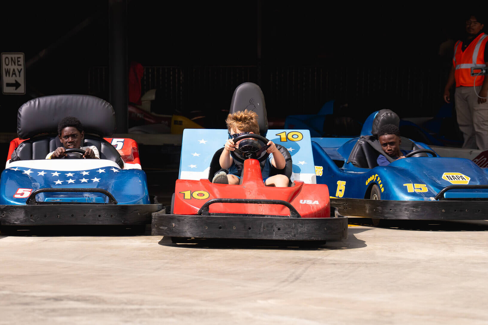 Drivers in go-karts lined up at the start