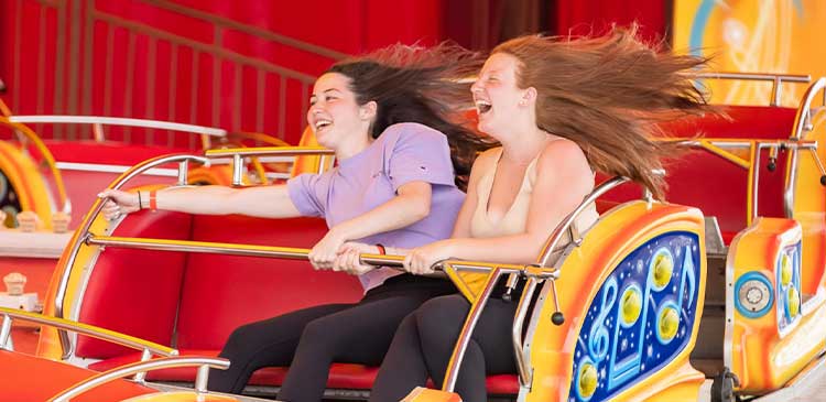 Friends riding together on a Casino Pier ride