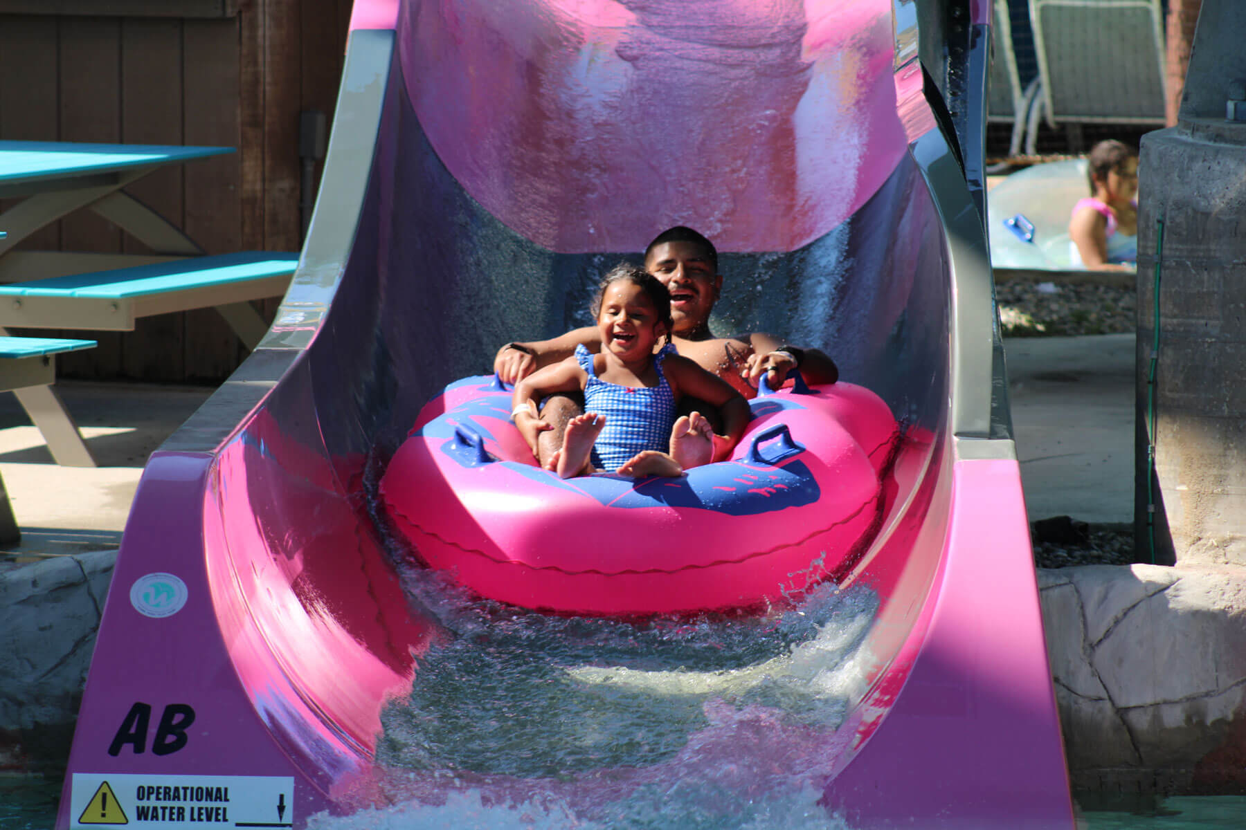 Riders on the Concord tube slide at Boston Sea Party