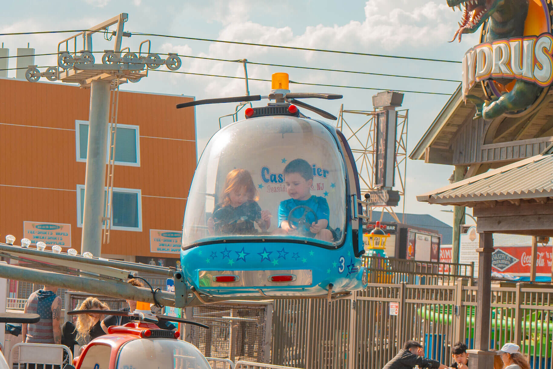 Child riding the Helicopters kiddie ride