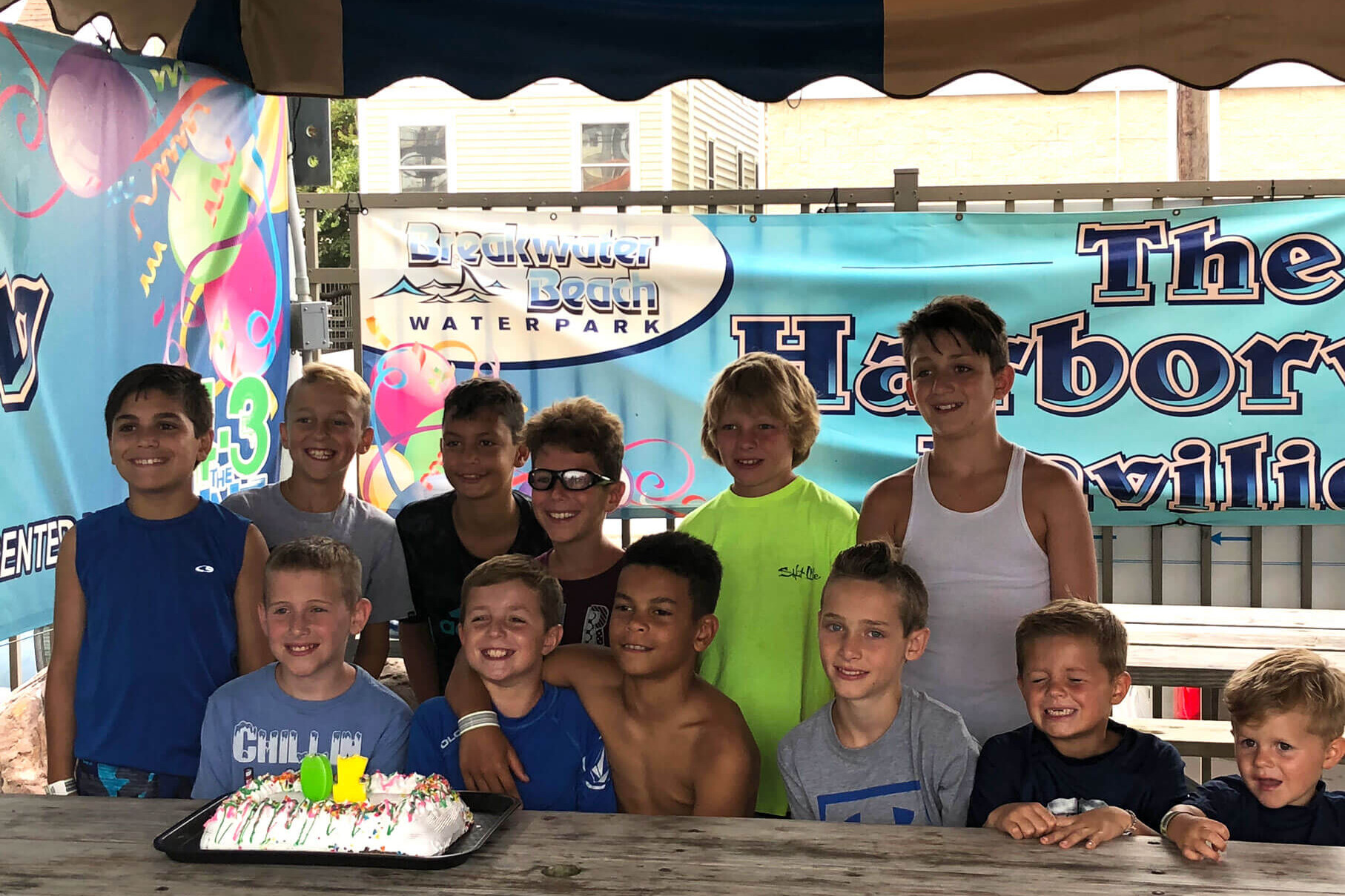 Kids with a birthday cake at one of the Seaside Heights birthday parties at Casino Pier