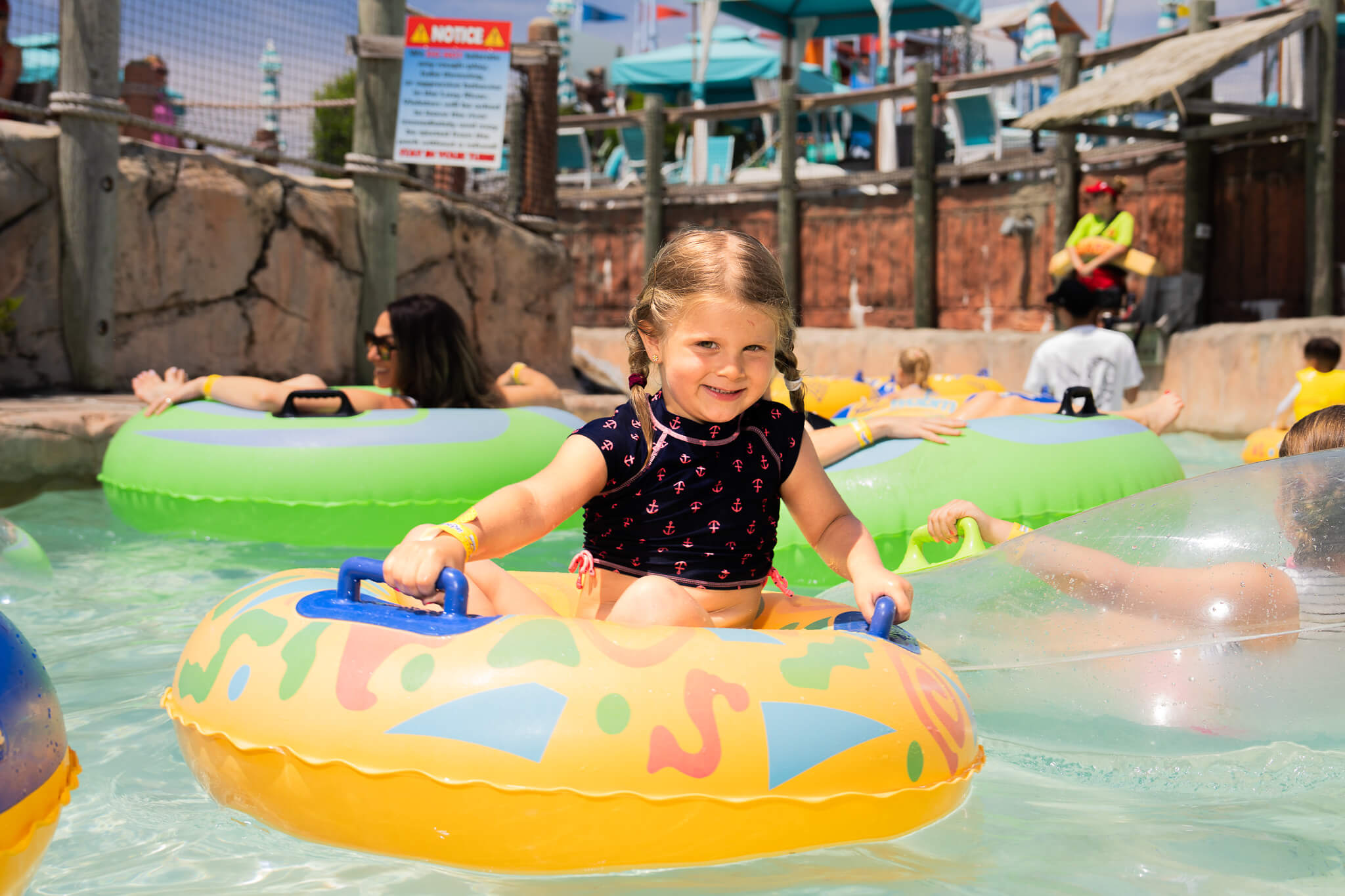 Child floating on a tube in the Revolutionary Lazy River