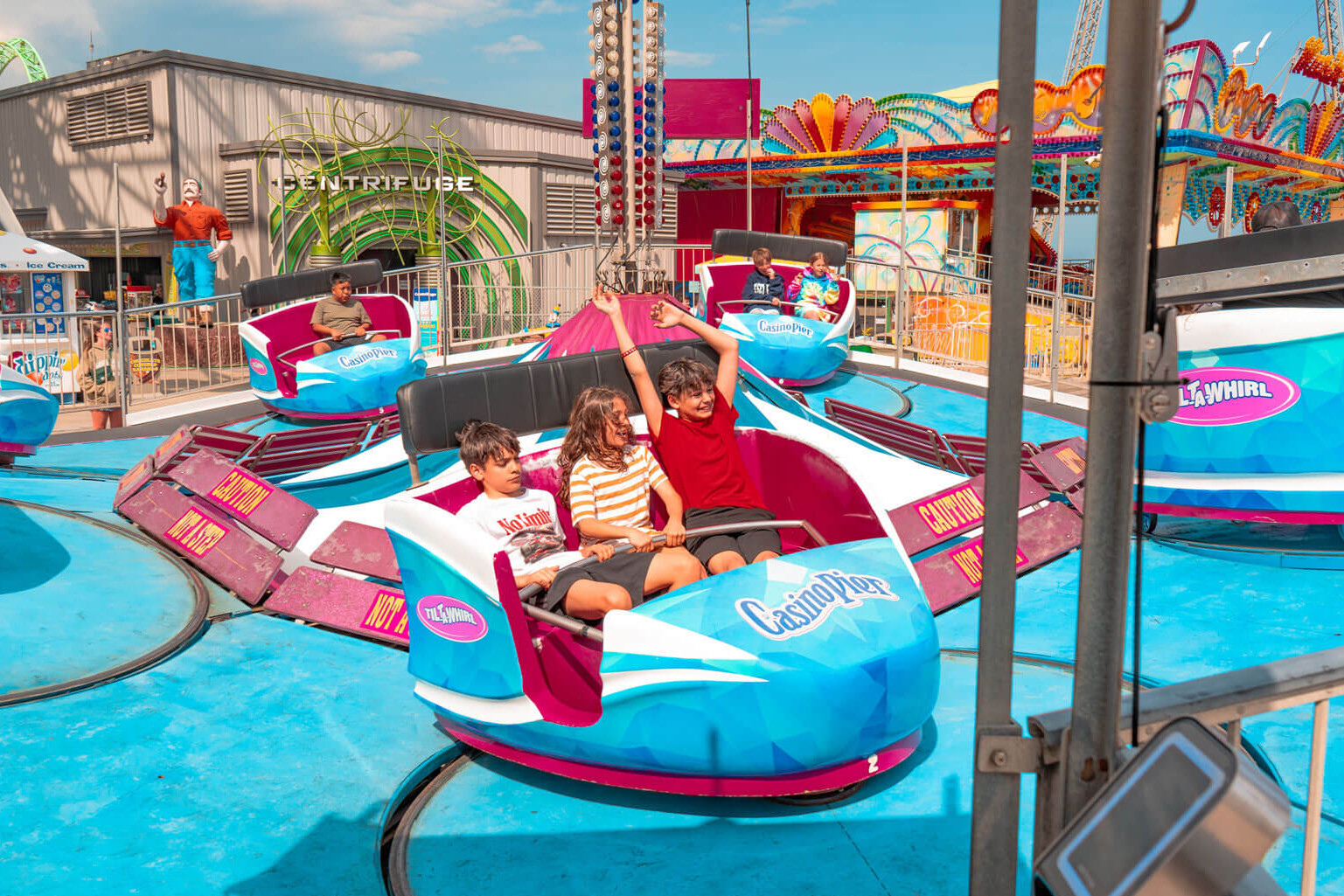 Riders on the Tilt-A-Whirl